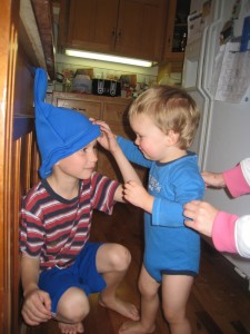 Jacob gets some hat-wearing tips from Benjamin