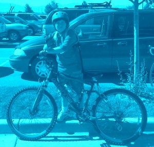 Anthony quickly eating a donut before getting back on the road. Dave's phone camera accidentally had a weird setting of a blue tint.  But at least we got this picture of him as he just took off on his own!