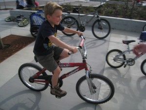 Benjamin on a "big boy bike".